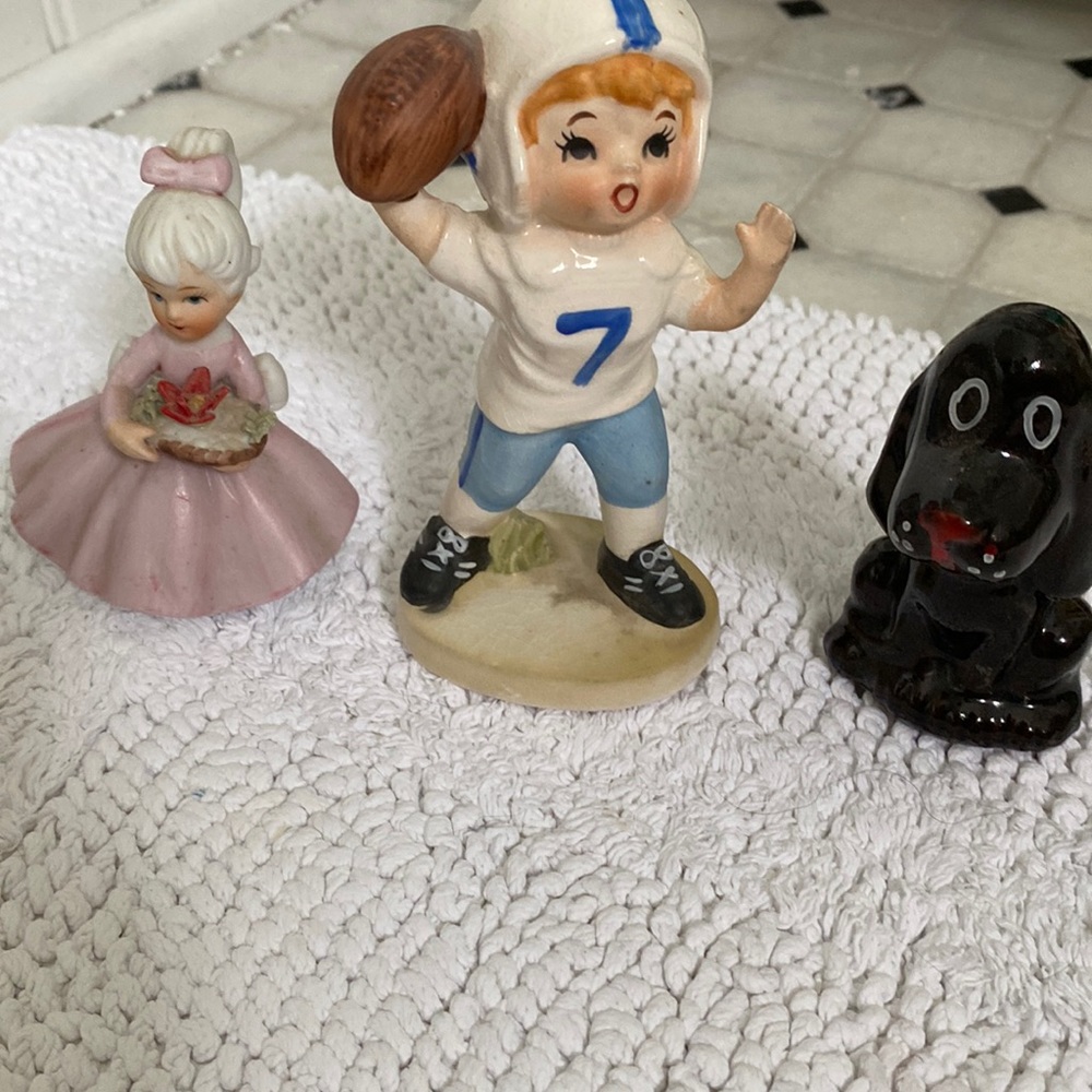 Three glass figurines December poinsettia figurine and girl football player &dog